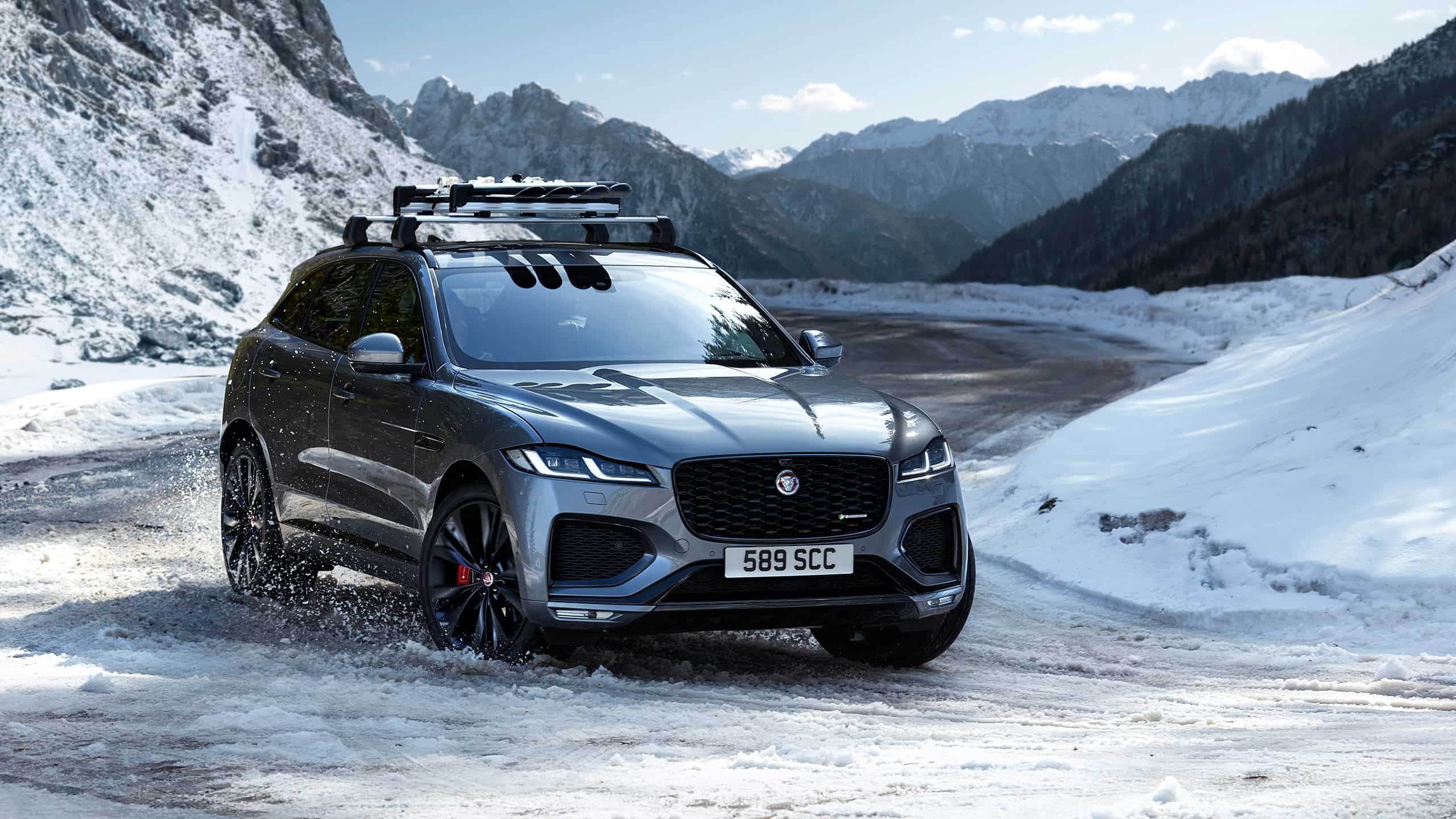 Parked Jaguar F-Pace  with  Snow Hill background