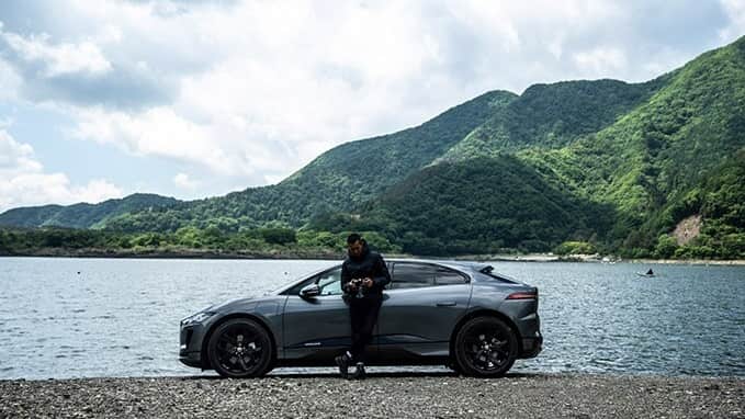 Hiro Kimura in front of a Jaguar I-Pace