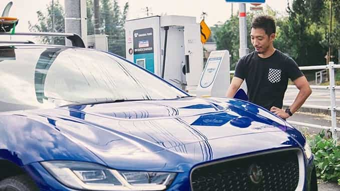 Ryosuke Nishida is charging a Jaguar I-Pace vehicle